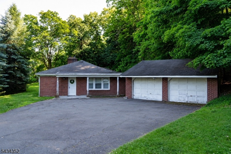 3-bedroom ranch situated on a dead-end street with a detached 2-car garage. This home offers a spacious living room with a fireplace, a kitchen featuring a center island and sliders to the side yard, a formal dining room, and a primary bedroom with a private bath.The property offers great potential for customization and the opportunity to add your own personal touches.Please note: This property is subject to lender approval. There is known soil contamination, which will be the responsibility of the buyer. SUBJECT TO THIRD PARTY APPROVAL -the buyer is resp for any town/mun requirements to close, including permits, etc.  Buyer is responsible for soil remediation