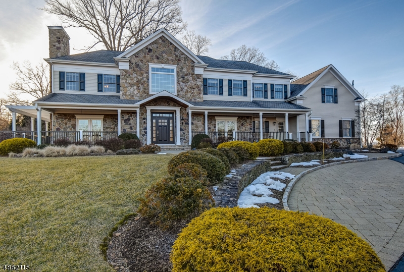 Understated elegance with an incredible attention to detail on an absolutely stunning .82 acre lot on a quiet cul-de-sac.  An incredible wrap-around front porch welcomes you to this light filled home. The 2-story foyer is flanked by formal living & dining rooms with architectural detailing, hardwood floors & french doors to the porch, the renovated kitchen has professional grade appliances, center island,sliders to the deck & opens to the family room with new stone faced fireplace, sunroom, incredible mudroom & 2 powder rooms completed the first floor.  Second floor features an spa-like master suite with sitting room, deck, 2 walk-in closets with organizers & luxurious bath, 4 additional bedrooms, 2 baths, office & laundry room.  Exquisite gardens & plantings, beautiful level lot. Close to everything!