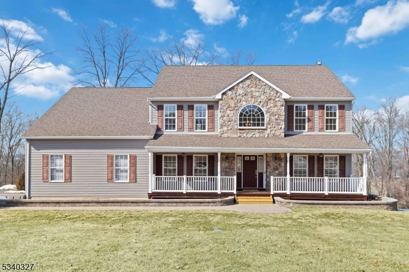 Welcome to this elegant 2003 Colonial nestled in the sought-after Meadow Ridge Estates! This spacious 4-bedroom, 3-bathroom home offers a versatile main-level bonus room, perfect for a home office or guest suite. Step into a grand two-story foyer, flanked by a formal living and dining room, leading to a beautiful eat-in kitchen with granite countertops, a breakfast bar, and seamless flow into the expansive family room. Cozy up by the wood-burning fireplace or step through sliding doors onto the brand-new deck (2024) ideal for outdoor entertaining!  A full bathroom and convenient laundry room complete the main level. Upstairs, the primary suite is a true retreat, featuring a sitting area, two large closets with extra storage one of them a walk-in with extra storage, and a luxurious en-suite with a jetted tub, dual sinks, and stall shower. Three additional spacious bedrooms and a full bath with a tub round out the second floor. The walkout basement offers high ceilings and endless possibilities to create additional living space, a home gym, or a media room. Additional highlights include a 2-car oversized attached garage, central vacuum, underground sprinklers, and a paved patio. Nestled in a private and peaceful neighborhood, this home offers the perfect blend of comfort and convenience. Don't miss the opportunity to make it yours!