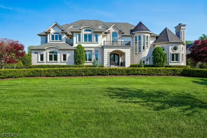 SET WITHIN THE EXCEPTIONAL BEL AIR WOODS ENCLAVE,THIS SPECTACULAR CUSTOM ESTATE Offers Nearly 12,000 Sq Ft Of Luxurious Living Space, 6 Bedrooms, 6 Full & 3 Half Baths. A Grand Two-Story Foyer W/Sweeping Staircase And Wrought-Iron Railings Sets The Tone For This Extraordinary Home. Sun-Filled Entertaining Spaces Include A DRAMATIC TWO-STORY GREAT ROOM WITH SOARING 21-FT CEILINGS, Floor-To-Ceiling Windows, & Fireplace, Elegant Formal Dining Room w/Tray Ceiling, Detailed Moldings, & Butler's Pantry. GOURMET CHEF'S KITCHEN FEATURES CUSTOM CABINETRY, GRANITE COUNTERTOPS, PREMIUM WOLF AND MIELE APPLIANCES, 2 SINKS, 2 DISHWASHERS, OVERSIZED CENTER ISLAND, & BREAKFAST ROOM. Multiple French Doors Open To An Expansive IPE Deck, Swim Spa, And Patio, Ideal For Indoor/Outdoor Living. SUN-DRENCHED LIBRARY, CUSTOM MILLWORK, DOUBLE HEIGHT CEILING, FIREPLACE, PANORAMIC WINDOWS, Overlook Lush Grounds. Desirable First-Floor Bedroom, (All Bedrooms Are En-Suite). LUXURIOUS PRIMARY SUITE; TRAY CEILING, FIREPLACE, SITTING ROOM, JULIET BALCONY, TWO CUSTOM WALK-IN CLOSETS, AND GORGEOUS MARBLE SPA BATH. Third-Floor Multi-Purpose Room Provides Flexible Living Space. Finished Lower Level w/10-Ft Ceilings Includes HOME THEATER, Recreation Room, Gym, Game Room, Additional Bedroom, & Walkout To Park-Like Backyard. Additional Highlights: Private ELEVATOR, 3-CAR GARAGE, EXQUISITE HIGH-END FINISHES THROUGHOUT, Prime Location Close To NYC Transportation, Shopping, Award-Winning Schools & Houses Of Worship.