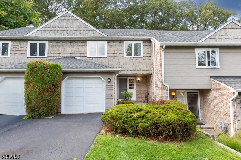 BRIGHT AND LIGHT, SPACIOUS TOWNHOME NESTLED IN THE SOUGHT-AFTER POWDER MILL COMMUNITY IS WAITING FOR YOU!!!   You will be impressed with this freshly painted home offering beautiful new flooring on both levels (except for the bathrooms).  First floor features sizable entry foyer, kitchen with brand new gas range, open concept living and dining space flows seamlessly onto a private deck for your enjoyment, relaxation, and entertainment.  Second floor will welcome you with two large bedrooms and main bathroom.  Unfinished basement provides ample storage or future finishing opportunities, as well a laundry room with brand new washer and dryer. You will love backyard with lots of greenery!  One car garage completes the picture of a wonderful home! Powder Mill Village gives you an opportunity to enjoy outdoor swimming clubhouse, pool and tennis courts!  Conveniently located near highways, shopping, and dining.  Parsippany is known for great schools!!  Come and fall in love with this home and make it your own!!!