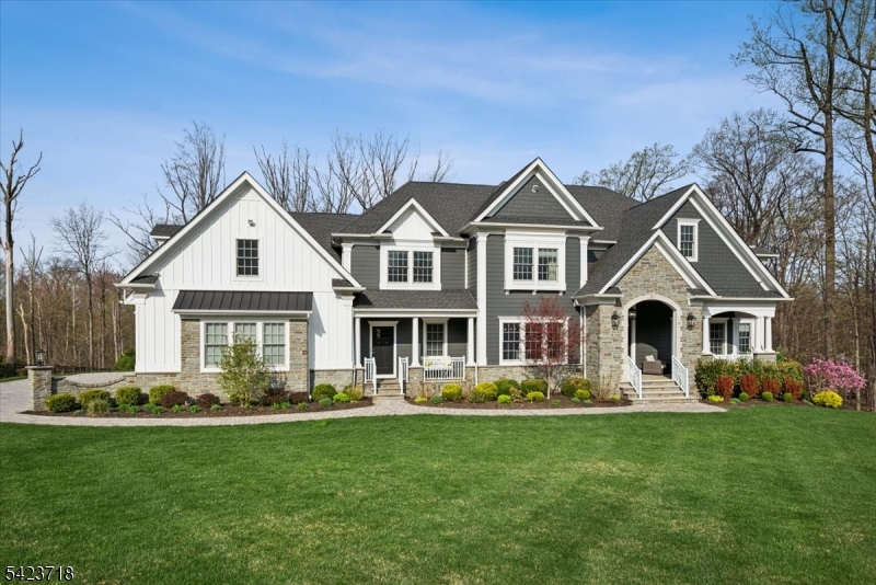 Set on 3 breathtaking acres, this exceptional "better-than-new  custom home offers a rare turnkey opportunity for the most discerning luxury buyer.Built by Warren's premier builders, this home exudes refined elegance, superior craftsmanship, and a level of privacy that is increasingly difficult to find. Acquired before completion, the current owners elevated every detail featuring bespoke flooring, designer moldings, a fully integrated, water-cooled whole-house generator, along with advanced high-profile security, interior/ exterior surveillance, exterior lighting, and leak detection systems.The heart of the home is the designer kitchen appointed with Sub-Zero, Wolf, and Fisher & Paykel appliances, complemented by premium quartz surfaces & impeccable finishes throughout. No expense spared in the professionally curated interiors, including custom furnishings, window & wall treatments. An exceptionally efficient & elegant floor plan offers a first-floor guest suite with a full bath, a private office with custom ceiling moldings, 2 staircases, & a beautifully designed mudroom. Expansive, high-ceilinged rooms provide an abundance of natural light & luxurious living space while multiple fireplaces enhance the home's warmth & ambiance including an additional fireplace in the recreation room. The primary suite serves as a true retreat, complete with a double-sided fireplace, custom walk-in closets, a sitting area, and a spa-inspired bath with an oversized shower &  soaking tub.