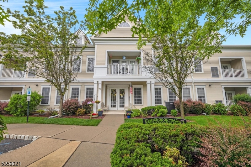 Welcome to this beautifully maintained 2nd-floor end unit in desirable Brookfield Glen 55+ community. This spacious 2-BR, 2-bathroom home includes versatile bonus room perfect for home office, den, or guest room. Enjoy serene, private farm views from windows and balcony, all within an elevator building offering convenience and accessibility. The open-concept layout features high ceilings, welcoming entry foyer, kitchen with abundance of cabinetry, island, newer appliances -refrigerator, microwave, dishwasher, range oven. Living and dining rooms feature durable flooring and plenty of natural light, ideal for both everyday living and entertaining. Primary suite includes oversized walk-in closet, dual vanity, walk-in shower. 2nd full bath features tub shower, linen closet. Carpeted 2nd BR and bonus room; dedicated laundry/utility room adds extra functionality. Updates include newer hot water heater (2016), washer, updated flooring in kitchen, BRs (2022). Other features include 2 reserved garage parking spaces, 2 private storage cages, ample interior closet space. HOA fee includes access to community's extensive amenities: clubhouse with pool, fitness center, shuffleboard, bocce courts, library, game rooms, walking trails, organized day trips/events. Building includes its own lobby, bathrooms, community gathering room. Move-in-ready opportunity to enjoy low-maintenance living in a vibrant, amenity-rich 55+ community with easy access to local shopping, restaurants, and more.