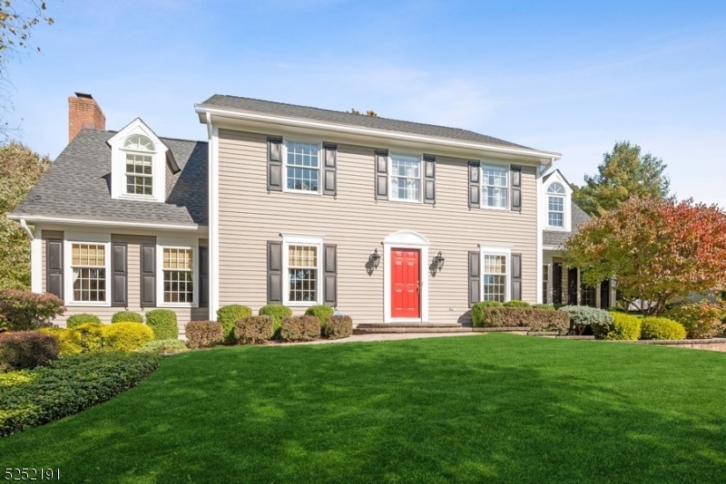 Stunning Colonial home is situated in the desirable Drakewick neighborhood, on almost 1/2 an acre of landscaped property overlooking a pond in the East side of Mendham Twp. This distinctive home offers 4B/ 3 1/2 Bth, an attached 2-car garage & an enormous bonus room. A stone paver walkway brings you inside featuring luminous hardwood floors, crown molding, large windows & custom details throughout. From the bright foyer, the layout flows to the Living Room & elegant Dining Room with wainscoting & French doors to the Family Room featuring a beautiful, natural stone fireplace with a large carved mantel, a wall of built-in shelving + cabinetry & a back staircase. The gourmet kitchen is appointed w/Viking high-end appliances including 2 ovens + 2 dishwashers, Sub-Zero refrigerator, custom Omega cabinetry, stone counters, center island & wet bar. Off the kitchen is a powder room & mudroom. The 2nd floor includes a lavish primary suite with a WIC, an adjacent bonus room that could be used as an office or sitting room, a back stairway & a luxurious en-suite w/beautiful soaking tub & heated floors. 3additional bedrooms share a full bathroom, also with radiant flooring. The finished basement features a sprawling recreation space, full bath, laundry area & storage. A multi-level stone patio in the artfully manicured backyard & sprinklers system completes the package of this exceptional home ideally located near highly rated schools, shopping, dining, golfing+tennis & major highways.