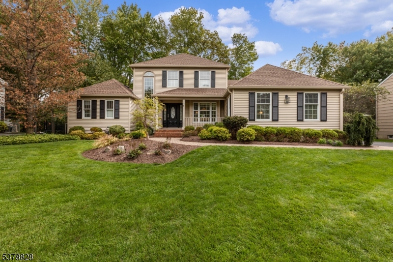Welcome to 9 Strawberry Lane! A beautifully maintained & updated Colonial blending timeless style with modern comfort. Arrive to manicured landscaping & a classic facade before stepping inside to a sunlit foyer. The living room greets you with a large bay window, crown moldings & hardwood floors, flowing into the formal dining room with front yard views. The eat-in chef's kitchen shines with granite countertops, custom cabinetry, a breakfast nook & quality appliances, opening to the spacious family room with vaulted ceiling, wood-burning fireplace & abundant light. The first-floor primary suite offers convenience with generous closets & a private full bath. A laundry/mudroom with direct garage access adds everyday functionality. Upstairs, three additional bedrooms provide comfortable space, ceiling fans & a shared full bath. The lower level offers a versatile partially finished basement with a full-width exercise room & additional storage. Outdoor living includes a spacious deck & level backyard with water views, perfect for relaxing or entertaining. Additional features include a two-car attached garage with automatic openers. This home is offered fully furnished for a move-in ready experience. Sewer & water included, tenant pays electric & gas. Located just minutes from downtown Morristown, with convenient access to shopping, dining & direct NYC transit, this home blends modern updates & classic design in an ideal location!