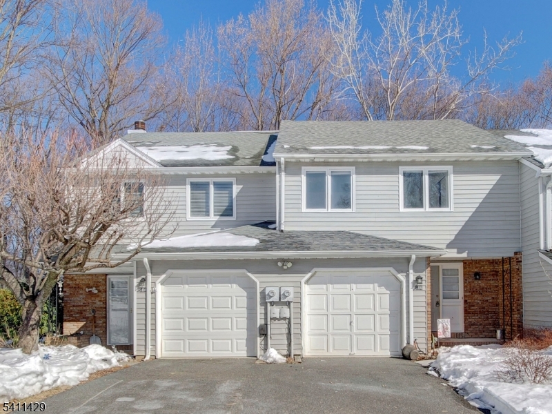 Welcome to this bright and spacious townhome nestled in the highly desirable Powder Mill community of Parsippany! Move-in ready, this beautifully maintained home offers an inviting layout and thoughtful updates throughout. The first level features a generous entry foyer, an updated kitchen with stainless steel appliances and an open-concept living and dining area designed for effortless everyday living and entertaining. Sliding doors lead to a private deck overlooking a lush, green backyard-- the perfect setting for relaxing or hosting guests. Upstairs, you'll find two generously sized bedrooms and a full main bath, offering comfortable and functional living space. The unfinished basement provides abundant storage and excellent potential for future finishing, along with a laundry area.  Residents of Powder Mill Village enjoy fantastic amenities including an outdoor swimming pool, clubhouse, and tennis courts. Conveniently located near major highways, shopping, dining, and all that Parsippany has to offer   including its highly regarded school system and desirable Morris Plains mailing address. Low monthly HOA fee! Don't miss this opportunity to own a wonderful home in a prime location. Schedule your private showing today and make it yours!