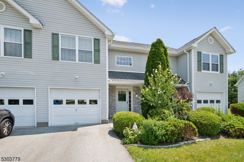Serene Setting & Convenient Location!  Lovely 2-bedroom townhome in the coveted Walden Village community with 2 bedrooms, 1.5 baths, 1-car garage and many amenities in a peaceful neighborhood with easy access to everything you need. A gracious front entry and foyer welcome you inside to an airy 1,400+ sq ft unit with many updates, including New Roof. Past interior garage access and a half bath with in-unit laundry, the main floor opens to a kitchen renovated in 2018, with glazed cabinet topped with granite counters stainless steel appliances and peninsula with seating. There's direct flow into an open living and dining room with rich hardwood floors and a gas fireplace for chilly nights. Sliding glass doors lead out to a patio and lawn that are perfect for indoor/outdoor entertaining, sipping coffee or cocktails, or just relaxing in the sun. The second floor is host to an oversized primary retreat with a huge bedroom and 2 walk-in closets, a second generous bedroom and a full hall bath with stone-topped storage vanity, tub/shower combo, and handy direct access from the primary. This wonderful community offers residents a club house, in-ground pool and adjacent playground, tennis courts and more. Close proximity to downtown Hamburg with shopping, dining, golf and more.