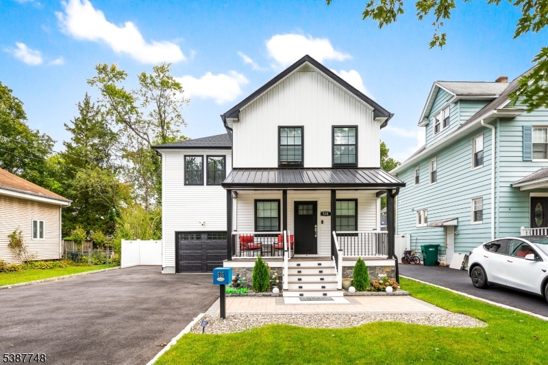 This completely rebuilt Colonial combines modern design, quality craftsmanship, and everyday convenience. Featuring 4 bedrooms, 3 full baths, and an open-concept layout, the home showcases a designer kitchen with quartz countertops, waterfall island, custom cabinetry, stainless steel appliances, and sliding doors leading to a private backyard retreat. The spacious primary suite offers a walk-in closet and spa-inspired bath finished with marble and porcelain tile. Three additional bedrooms, a full bath, and convenient second-floor laundry complete the upper level. The finished lower level provides flexible space for a home office, gym, playroom, or recreation room. Step outside to your own backyard oasis featuring a spacious patio, pergola, above-ground pool, privacy fencing, and plenty of room for entertaining, relaxing, and enjoying summer gatherings. Additional highlights include an oversized attached garage, newly paved driveway, multi-zone HVAC, and abundant storage. Ideally located near NYC transportation, major highways, shopping, dining, and highly rated schools. Move-in ready and offering the perfect blend of luxury, comfort, and convenience.