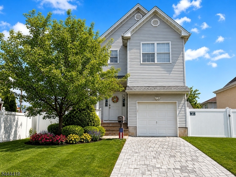 Beautifully maintained 2015-built Colonial offering modern living, generous space, and commuter convenience. This 4-bedroom, 2.5-bath home features an open floor plan with a kitchen boasting granite countertops, stainless steel appliances, ample cabinetry, and views of the family room. Hardwood floors throughout complement the home's spacious layout. Major updates include a multi-zone HVAC system (2015 & 2026), HWH (2025), two Nest thermostats, electronic keypad entry, Ring-style camera doorbell, and many other thoughtful upgrades for today's lifestyle. The spacious primary suite includes a private ensuite bath. A large laundry room adds convenience, while the finished basement offers flexible space for a recreation room, home office, gym, or media room. A walk-up attic and abundant closets provide exceptional storage throughout. Enjoy the fully fenced backyard w/a paver patio, perfect for entertaining, plus a paver block driveway and energy-saving solar panels. Move right in ready. Conveniently located near the NJ Tpk, GSP, and Rts 1 & 9, w/easy access to NYC. Perth Amboy and Woodbridge NJ Transit stations are just minutes away, along with nearby bus service. Close to shopping, restaurants, parks, Rutgers University, downtown New Brunswick, and more.  A wonderful opportunity to own a newer home with modern amenities in a prime Middlesex County location. Disclaimer: Some photos virtually staged and/or enhanced. All dates and measurements are approx.