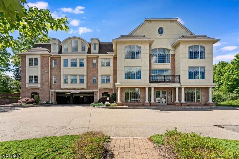 Enjoy easy, low-maintenance living in this spacious two-bedroom, two-bath condo located in The Hamlet, a desirable 55+ elevator building right on Main Street in Sparta. The thoughtfully designed floor plan offers comfortable living space, while the building's amenities make everyday life that much more convenient. Residents enjoy the convenience of a parking garage, an exercise room, and a beautifully maintained paver courtyard, perfect for relaxing outdoors or visiting with neighbors. The elevator provides easy access throughout the building, making coming and going effortless. One of the best features is the location. Right outside your door you'll find several restaurants, cafes, and the post office, giving you the freedom to leave the car at home and enjoy everything downtown Sparta has to offer. Whether you're looking to simplify your lifestyle or enjoy the convenience of in-town living, this condo offers the perfect combination of comfort, amenities, and an unbeatable location.