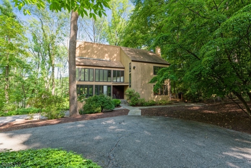 Gorgeous Contemporary home situated on 3 acres of countrified privacy. This beautiful home boasts four bedrooms, two full and two half bathrooms, an attached two-car garage. Stunning modern kitchen with hardwood floors, granite counters, SS appliances & gorgeous cabinetry. Breakfast area includes a built-in workstation & sliding glass doors to a large deck.There is a dumbwaiter & laundry chute in the kitchen. Formal DR has built-in cabinets. Large primary bedroom suite is located upstairs, w/dual sinks in bathroom. 2 additional bedrooms, full hallway bathroom & an office complete this floor. The finished lower level has a powder room, access to the garage, & a rec room, 2 sets of sliding glass doors to the back yard. Whole house generator & more! Conveniently located near Rt 287, shops, eateries & parks.