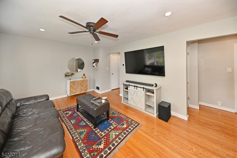 Beautifully maintained Cape Cod-style home nestled in a well-established neighborhood of Clifton, offering the perfect combination of charm, comfort, and convenience. This move-in ready 3-bedroom, 1-bath home features an updated eat-in kitchen, gleaming hardwood floors throughout, and a warm, inviting layout filled with natural light. Enjoy outdoor living in the fully fenced, flat backyard complete with a newer paver patio, beautiful landscaping, and elegant exterior lighting   perfect for entertaining or relaxing in a peaceful setting. The oversized 2-car garage provides ample storage and functionality, while thoughtful upgrades throughout the home include newer central air, a Nest thermostat, smart irrigation system, Ring security cameras, newer garage door, newer front and rear pavers, and new front steps. Ideally located with easy access to major highways, shopping centers, dining, parks, and public transportation, including convenient commuting options to NYC, this home offers suburban tranquility with exceptional accessibility. A wonderful opportunity to own a lovingly maintained home with timeless appeal and modern updates throughout. Call for your appointment today!