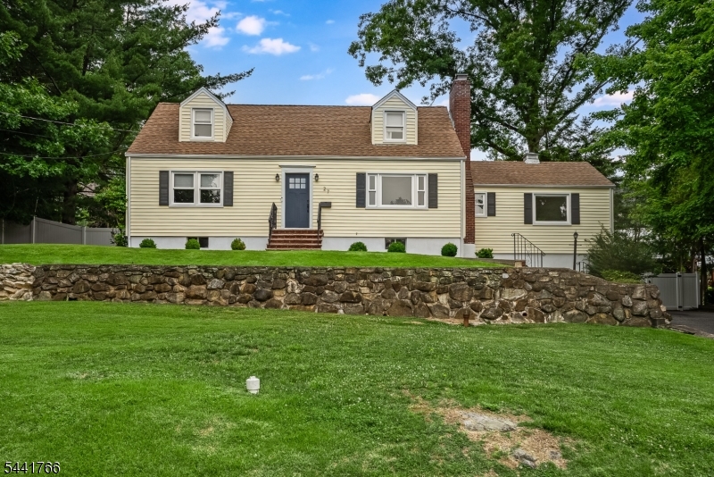 Recently renovated expanded cape cod on lovely tree-lined street in the heart of Morris Plains.  Steps to schools, parks, NJ Transit train and all that vibrant downtown offers.  Hardwood flooring and wood burning fireplace in living room.  Bright, sunny kitchen with stainless appliances, custom cabinets, quartz counters and oversized center island makes everyday cooking and special occasions a joy.  Dining area for evening meals opens to large family room  with wood floor, powder room, and picture window offering view of level yard.  Two bedrooms and full bath on first floor as well as two bedrooms and full bath upstairs gives plenty of versatility for different needs.  Full unfinished basement with laundry, utilities and lots of storage room.  Forced hot air heat and central air.  This home is absolutely in move-in condition and meticulously maintained.  It's a pleasure to see.