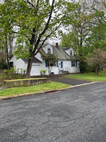 A true 'Diamond in the Rough' - situated in one of the most desirable areas of West Caldwell on a cul de sac, this three bedroom (potential for 4th) has two full baths and a full 'high ceiling' basement.  Hardwood floors throughout first level with access to covered 11x10 porch overlooking level spacious rear yard.   Wonderful location, gas heat, city water/sewers.  Ready for your personal touches and upgrades to make it perfect!  Home including fireplace is being sold 'as is' although any issues are unknown.  An amazing community, schools, shopping, restaurants - near major highways and transit.