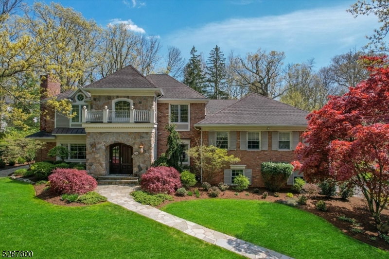Designed for year 'round entertaining, this stunning custom home sits on beautiful, private property, w/mature landscaping, gorgeous specimen trees & perrenials, w/expansion/renovation by architect Tom Baio in 2004.  Elegantly appointed w/2 story entry foyer, high quality moldings & coffered ceilings, Brazilian cherry wood floors in the 25' long center hall entry foyer, walk-in coat closets & formal powder room. Gracious formal living room w/FP, all recently redone, elegant dining room w/grass cloth and ideal for art display, seats 14, grand family room w/huge wall unit, wall of windows, 2 story ceiling, opens to gourmet eat-in kitchen w/separate office, pantry closet, 2 center islands, full size SubZero Refrig/freezer w/4 drawers, double Miele ovens, 4 sinks, wet bar, 2 dishwashers, 2 doors to patio. Back hall has1/2 bath & 2nd laundry. Upstairs are 5BR's & 4 bths, all spacious w/ tons of natural light & big custom closets. The Primary BR takes most of the 3rd flr w/vaulted ceiling, gas FP, 3 big closets, office nook, new wall to wall, luxurious bath w/2 separate sinks & shower, private commode w/window & lovely views from the oversized tub. On the ground level there is a family rm w/2 big storage closets for outdoor cushions/party stuff, a billiards rm, steps to an oversized garage, as well as a huge fin, dry basement w/1000 bottle wine cellar, full bath, rec rm, gym or BR w/egress window, 2nd laundry rm, 2 utility rms w/French drains, 2 sump pumps & storage closets.