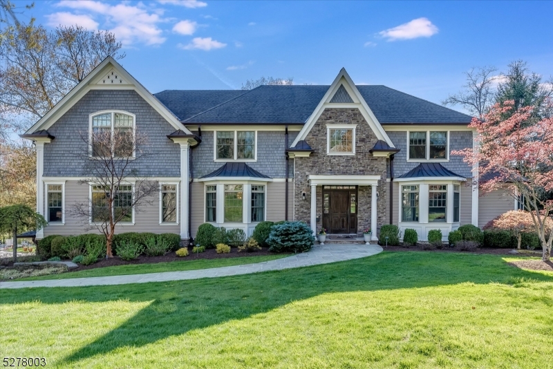 Stunning 7 bed, 6.1 bath home located in one of Short Hills' most picturesque neighborhoods. Built in 2012, this home is filled with custom touches, including upgraded lighting, designer wall coverings, and more. The first floor features a grand foyer, elegant dining room, butler's pantry, gourmet eat-in kitchen with center island and high-end appliances open to a generous family room, tranquil living room, conservatory (can be used as 2nd office or playroom) and powder room. A convenient back wing with 2 pantries, mud room and office/guest room with full bath completes the first floor. The upstairs living quarters can be accessed either by the front or back staircase. There are 5 spacious bedrooms and 4 baths (3 ensuite), all with generous walk-in closets, including a large and well appointed primary suite with luxurious marble bath. There is also a bonus common room/play area on the second floor. The third floor is partially finished, easily built-out and offers endless storage. A huge walk-out basement with a bedroom, full bath, gym and rec room is perfect for entertaining and every day play. There is a large deck off of the kitchen/family room and the house sits on a flat .5 acres with a 3 car garage. Generator, underground sprinklers, security system, gleaming hardwood floors. It is an ideal setting to host family and guests, both inside and out.