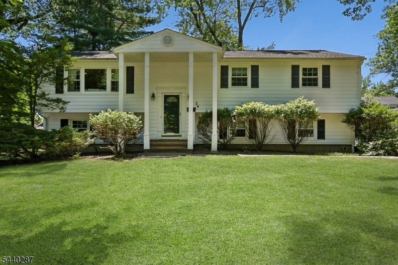 Beautifully updated home in the highly desirable Cherry Hill section of town. Conveniently located with easy access to top rated schools, major highways, houses of worship. parks and recreation, shopping dining and public transportation. The main level features a stunning custom kitchen complete with stainless steel appliances, granite countertop and a sliding door to a spacious rear deck- perfect for outdoor entertaining, The main bath is also renovated with custom vanity with elegant marble countertop and a tub/shower combo. Also adding  warmth and character to the gracious living room and dining room are beautifully refinished wood floors  and recessed lighting. The walk-out lower level provides exceptional flexibility with a 4th bedroom that can also serve as a home office, a spacious family room with sliding doors leading to rear patio, powder room, laundry room, and direct access to 2 car garage, Additional updated includes new hot water heater, newer roof, updated windows and sliding doors and updated mechanical systems.