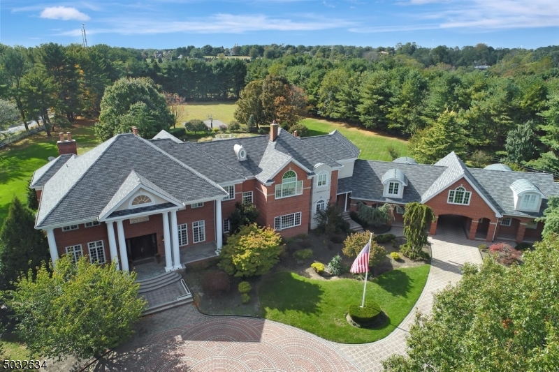 Cstm blt all brick Col features exquisite appntmnts w/a unique & impressive flr plan thats been cstmized from lavish interior to country club yard, 10 ft clngs 1st flr, Gourmete kit w/9' center island Separate Dinete wlk-in pntry imprtd hrdwd Mple flrs 4 frplcs, magnif Mstrbdrm  w/mrbl flrs,stm shwr whirl pool tub, his&her lrg wlkin clsts 700 btl wine rm 1200 sq ft rec rm w/full bth,stm shwr leads to outdoor patio&pool, wet bar sub zero frig, 10 zn htng systm 5zn hybrid, 5 zn radiant heat 65'heated ingrnd poolw/water fall&12 person spa, lavish lndscpng 4 car htd gar, 6 yr.old, 30 yr. slateline roof w/lightng rods, automatic gas generator for black outs, over $500,000 in pavers for driveway,patio,pool area,m 3 room guest or in-law suite w/full bath & prvt entrance, bsktbal court, & pergola sitting area by pool