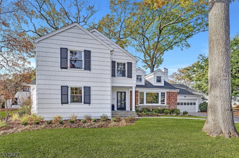 Situated on one of the most desirable streets in town, this renovated and expanded Colonial offers a unique opportunity for refined living. With over 4,200 square feet of luxurious space, this home seamlessly blends classic charm with modern amenities.Upon entering, you're greeted by the warmth of hardwood floors that flow throughout the house. The expansive layout features a gourmet kitchen, perfect for culinary enthusiasts, with top-of-the-line appliances and ample counter space. Adjacent to the kitchen, a charming breakfast room invites casual meals bathed in natural light.The home boasts five spacious bedrooms and four full baths, along with two half baths. The first-floor en suite bedroom is ideal for guests or multi-generational living. The second floor reveals another en suite bedroom and a luxurious master suite, a private retreat with a large en suite bath and a versatile bonus room, perfect for an office or sitting area.Practicality meets style with a second-floor laundry room. The finished basement provides additional living space, ideal for a media room, play area, or home gym.Step outside to a large blue stone patio, perfect for entertaining amidst beautifully landscaped surroundings. The property also includes a custom mudroom and a two-car attached garage, enhancing its functionality and appeal. Don't miss your chance to make this exceptional property your own.