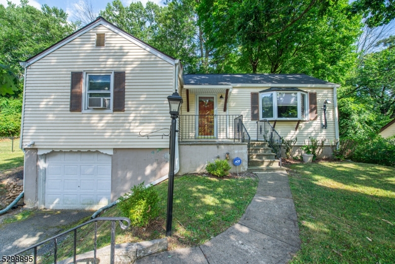 Why rent when you can have your own two bedroom home, conveniently located in Rockaway Twp. (with a Dover mailing address). This home is near mass transit, shopping and schools, yet peaceful and serene. Large fenced yard, beautifully tiered, with newer stone wall and covered patio for outdoor fun, and entertaining. Many updates include newer roof gutters, hot water heater, fence, outdoor shed, and some windows. The kitchen has newer appliances including a portable dishwasher and breakfast bar! Living room/dining room combo, a pellet stove (with pellets to get you started this winter in the garage) to keep the house cozy warm in the cold months, hardwood floors, newer washer and dryer in the basement, a stainless steel slop sink, and a one car garage. Come put your personal imprint on this great house and call it your home! (Note* Gas in street).