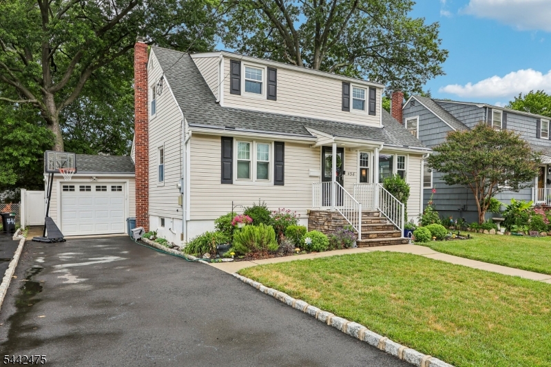 Beautifully expanded Cape in the heart of Garwood, offering 4 bedrooms, 2.5 baths, and a fully updated, move-in-ready interior. The first floor features a spacious living room, modern MEIK, two comfortable bedrooms, a refreshed full bath, and a bright sunroom/dining area with slider leading to the Trex deck. The second floor presents two expanded bedrooms and an updated full bath, providing generous space and flexibility. The finished basement adds exceptional bonus living with a rec room, half bath, storage, and laundry. Hardwood floors, central air, a fully fenced yard, and thoughtful updates throughout complete this inviting home. Ideally located near Garwood?s shops, parks, schools, and NYC transportation.