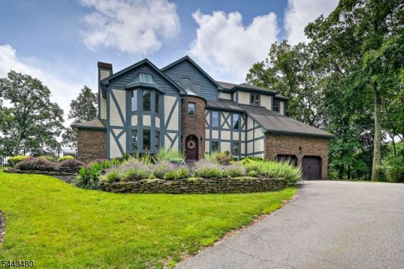 Lake Mohawk Charm!  Lovely Tudor Style 5 Bedroom 3.5 Baths, beautiful Lake Mohawk Views.Moment, you walk into home feels like a warm hug Welcoming you. Once you step into Living room & Kitchen area's overlooking beautiful deck / pergola area to enjoy sunrises over the lake. Lake Mohawk has much to offer residents, boardwalk to stroll on, many eateries boating, water skiing, kayaking, join the sailboat club & Famous Ski Hawks!