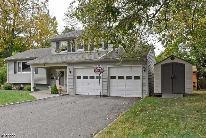 Great opportunity to live in a fantastic home in Rockaway Township. This spacious four bedroom two and a half bathroom home is a must see. The homes open floor plan provides for a great entertaining space in the updated kitchen and family room, which opens to the paver patio.The formal dining room and living room with cathedral ceilings add to the living space of this great home. Radiant heat throughout the first floor. The second floor offers the homes four bedrooms and updated full bathroom. Included in the four bedrooms is the master suit which features ample closet space and an updated full bathroom. The private landscaped yard with a paver patio in a great neighborhood makes this home a can't miss.