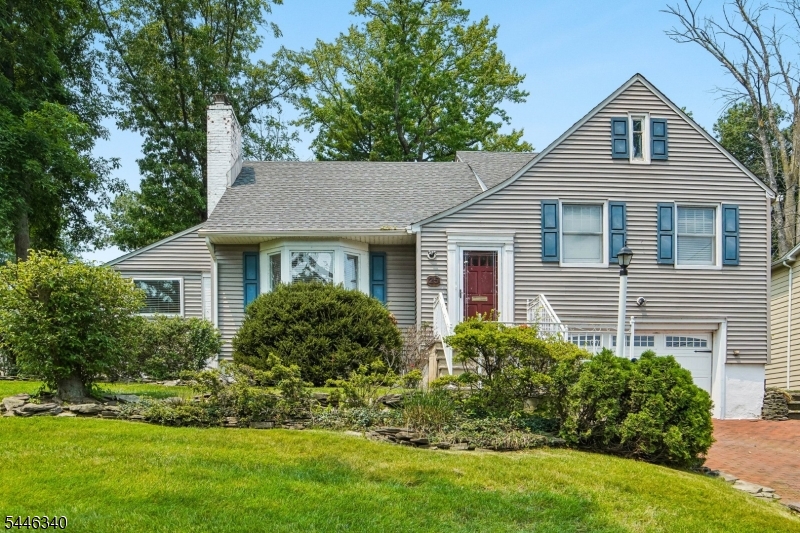 Perfectly positioned in desirable Packanack Lake, this split-level home offers beautiful lake views and an exceptional lifestyle just steps from the beach, playground, clubhouse and restaurants. Charming curb appeal and a brick paver driveway create a warm first impression. Step inside to discover a floor plan that flows effortlessly from room to room. The living room features a beautiful fireplace and recessed lighting, flowing seamlessly into the formal dining room with charming built-in cabinetry. The bright kitchen is equipped with stainless steel appliances and opens to a glass atrium breakfast room where walls of windows fill the space with natural light. Sliding glass doors lead to the patio and a large, level backyard, perfect for relaxing, entertaining, or outdoor play. Offering 4 generously sized bedrooms, 2 full baths, and a convenient powder room, this home provides room for everyone. An additional office or flexible living space offers endless possibilities for working from home, a playroom, or hobby room. Hardwood flooring extends throughout most of the home, adding warmth and continuity to the living spaces. The finished basement expands your living area with a family room featuring a second fireplace, powder room, and lots of storage. Combining spacious living, lake views, and an unbeatable location with Packanack Lake's amenities just steps away, this home captures the very best of lake community living. Close to NYC transportation.