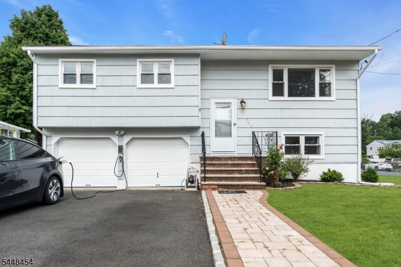 Welcome to this charming, move-in-ready bi-level home in a highly desirable Edison neighborhood! Inside, you will find a bright, well-maintained living space featuring 4 bedrooms, 2 full bathrooms, and fresh paint throughout. The updated kitchen is a home cook's dream, offering plenty of quartz countertop space, newer appliances, and a cozy breakfast nook. Major mechanical upgrades provide total peace of mind, including newer HVAC system installed in 2025 and a hot water heater from 2022. Outside, the property boasts a beautiful, fully fenced backyard perfect for entertaining along with an attached 2-car garage and a spacious driveway. Located in a prime commuter spot, this home puts you just minutes away from excellent Edison Township schools, local shopping, dining, Route 27, and the Edison Train Station.