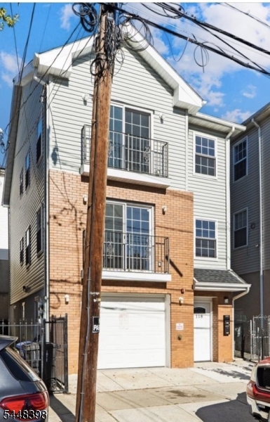 Exceptional new construction 2-family home built in 2022, ideally located in Newark's desirable North Ward, just off Broadway between Chester and Delavan Avenues near Belleville. An outstanding opportunity for both owner-occupants and investors, the 2nd-floor apartment is vacant and ready for occupancy, while the 1st-floor apartment is occupied by a quality tenant, providing immediate rental income to offset your mortgage.The vacant 2nd-floor apartment features a bright open-concept living and dining area, a beautifully appointed kitchen with stainless steel appliances, 2 spacious bedrooms, a full bath, ample closet space, and convenient pull-down attic storage.The 1st-floor apartment offers a similar open-concept layout with stainless steel appliances, 2 generously sized bedrooms, and a full bath. This apartment also enjoys exclusive access to the finished lower level, complete with a laundry area, 1/2 bath, direct exterior access, and an exceptionally finished built-in garage featuring attractive vinyl flooring, finished walls, and abundant lighting. This versatile space provides endless possibilities for storage, a workshop, home gym, hobby area, or additional rec space.Built with modern systems, contemporary finishes, and separate utilities, this low-maintenance property offers lasting value and exceptional versatility. Conveniently located near Branch Brook Park, shopping, restaurants, major highways, and public transportation with easy access to New York City.