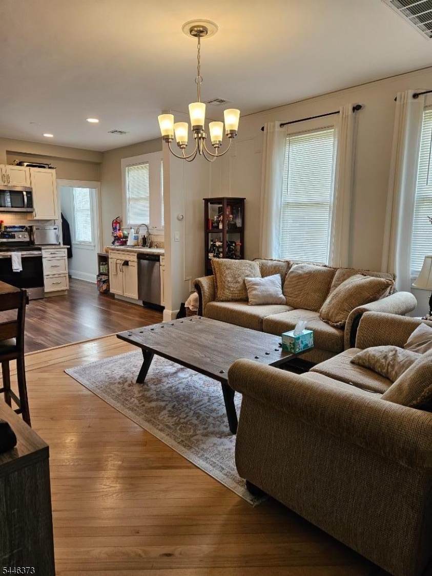 Beautifully renovated 2nd-floor apartment offering 4 bedrooms and 2 full baths, situated in the highly desirable Warren Township with a highly rated school district. Features include a spacious living and dining area hardwood floors throughout, updated kitchen and baths, high ceilings, basement laundry, and 2 assigned parking spaces. A large loft is also available for an additional fee, offering flexible space for a home office, recreation room or extra storage. Conveniently located near the town center, public transportation, shopping, dining, parks, and major commuter routes. No pets and no smoking. Tenant insurance is required. Available for August 1st occupancy.