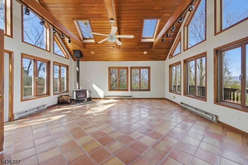 BOM- PREVIOUS TRANSACTION CANCELED DUE TO BUYER'S INABILITY TO PERFORM. Enjoy beautiful views of the Delaware Water Gap from this home, offering a setting that's hard to replicate- perfect for those who can see the beauty & potential in this home.The expansive great room is the highlight of this home, featuring vaulted wood ceilings, skylights, exposed beams, and walls of windows that fill the space with natural light. Step out onto the front balcony to take in the peaceful, panoramic countryside views. The kitchen shows signs of updating w/oak cabinetry, ss appl, granite countertops & tile flooring. The living room offers a touch of that vintage 60's vibe with built-ins, while the views continue from the front window. An oversized rear deck extends into a backyard that once offered a charming park like setting, where flowers are just beginning to peek through, offering a glimpse of what it can become again w/a little vision & care. While the home is in need of repairs, it offers tremendous potential for the right buyer to restore and make it their own. CASH or RENOVATION TYPE MORTAGES ONLY! Home is being sold strictly "as is" as part of an estate sale- no repairs or credits will be provided. If you've been looking for a home with views, character, and the opportunity to create something special, this may be the one worth bringing back to life.ote that this home is priced accordingly for its condtion and needed updates.