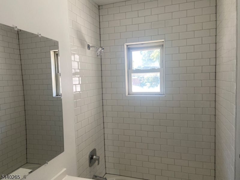 Free standing single family bungalow with New Fully Equipped Kitchen with SS Appliances! New Bath, full basement with Washer and Dryer!Nice open front porch and small rear patio!  Across from Grammer School, Eateries and Banking! Bus Pickup 100 feet from house!.Ideally located to everything!