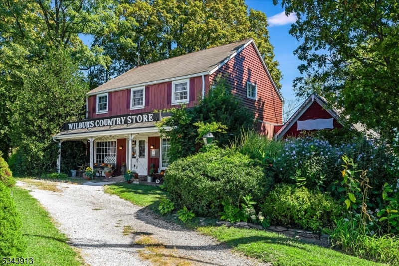 Unique opportunity to live and work on a beautiful property! "Wilbur's Country Store" with a spacious studio apartment above. Beautiful views from every window! And backs up to 35 acres of Nature Conservancy land. Lots of potential with this well established store plus four other commercial spaces rented. Great visibility on Rte 94 and over 300' of road frontage for easy access. Some work needed on the buildings. Charm abounds and could be a wonderful deli, coffee shop, crafter's village, etc. in addition to continuing this well appointed store.