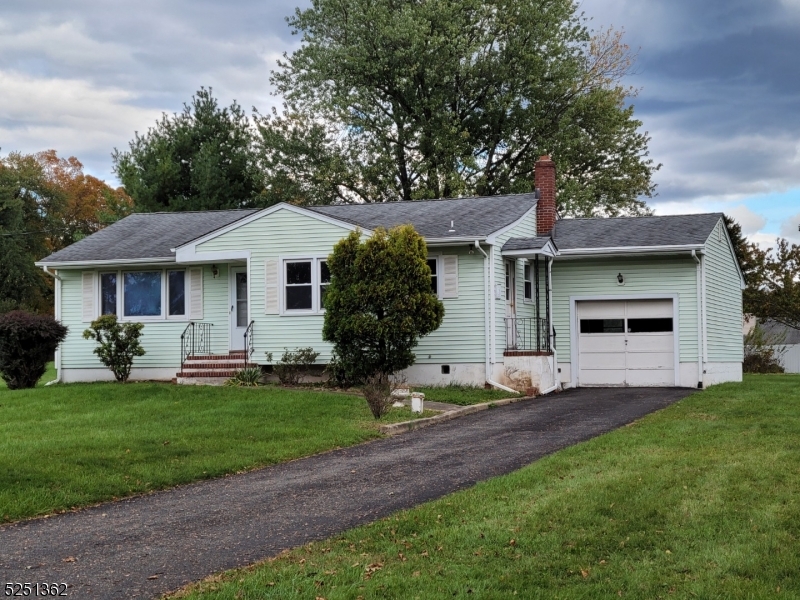 Property, Accessibility, Opportunity all describe this 3 Bedroom Ranch located near the end of the Park Lane cul-de-sac. This home is situated on just shy of 1 Acre of Land and the lot is open and level (great for all of those outdoor activities) and yet is minutes away from major roads such as Route 22, 31 and Route 78. This ranch style home also offers an opportunity to grow and expand with additional living space and yet, as it is, offers 3 bedrooms, all with hardwood flooring. The mostly finished basement adds to the recreational space of this home and is just in need of some type of flooring (carpeting or tile). This home also includes a one-car, attached garage and plenty of additional parking in the paved driveway. Some additional features include thermopane, tilt-in insulated windows, recessed lighting, a separate Laundry room  with a washer and dryer. Additional appliances include the gas stove top, gas oven and refrigerator. If you are looking for an alternative to condo/townhome living and want to grow into this home, then this just may be the right home for you!