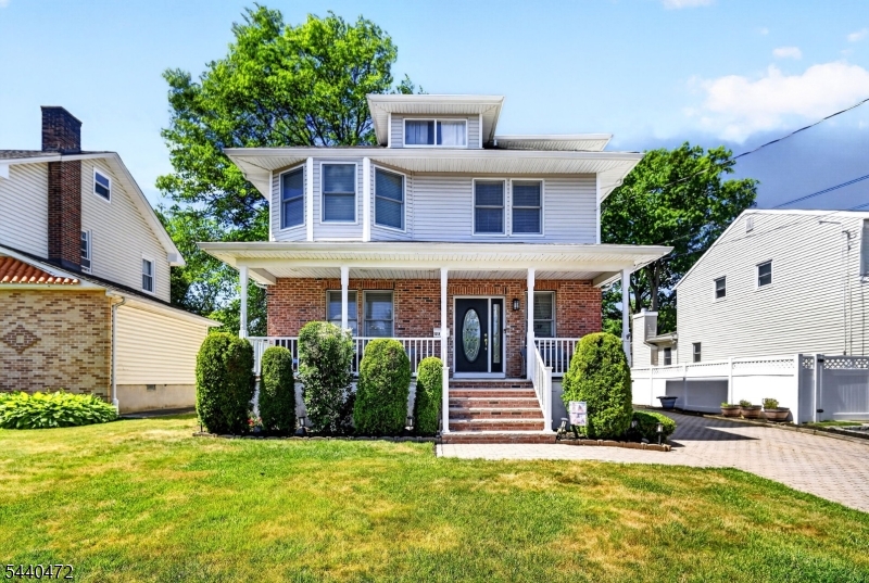 Immaculate Colonial on a deep 50 X 200 Lot. This move-in ready home features 5 bedrooms, 2.5 baths, and an exceptional floor plan. A charming front porch welcomes you into a stunning tiled entrance foyer. The first floor has high ceilings, hardwood floors, recessed lighting throughout, and spacious formal living and dining rooms. The heart of the home is the beautifully appointed eat-in kitchen featuring cherry cabinetry, granite countertops, breakfast bar, and open layout flowing into the family room with a cozy gas fireplace and access to the deck. Upstairs, the impressive primary suite offers vaulted ceilings, two walk-in closets, and private spa-like bath with a jetted tub. Generously sized bedrooms provide space for guests, or a home office. The third-floor walk-up attic offers incredible flexibility and can serve as a fifth bedroom, office, playroom, or bonus space to fit your needs. The large finished basement provides additional living and entertaining space, along with abundant storage and a sump pump with backup battery. Step outside and enjoy the beautifully maintained exterior featuring a large wood deck, manicured lawn and yard, paver driveway, storage shed, and a detached two-car garage with a loft perfect for storage, workshop, or future possibilities. Additional highlights include 2-zone central air & heating, HW floors, recessed lighting throughout, and unbeatable location close to schools, shopping, dining, and transportation.