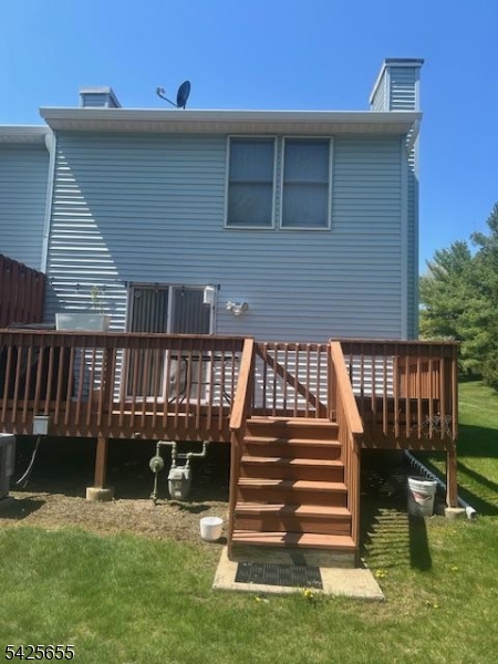 Enjoy comfort and convenience in this private end-unit townhome located in desirable Franklin Meadows. The community features an outdoor pool, clubhouse, and tennis court. This multilevel layout offers great living space, modern updates, and a prime location close to shopping and Route 23 for an easy commute. The living room opens directly to a large rear deck with stairs to the yard, perfect for outdoor dining and relaxing. A cozy fireplace in the living room adds warmth and charm. Upstairs, you'll find 2 spacious bedrooms and a full bath, with an additional half bath on the main level. The finished basement provides valuable extra living space ideal for a family room, office, or gym, and includes a dedicated laundry/utility room for added convenience. A great combination of privacy, location, and functional living space.