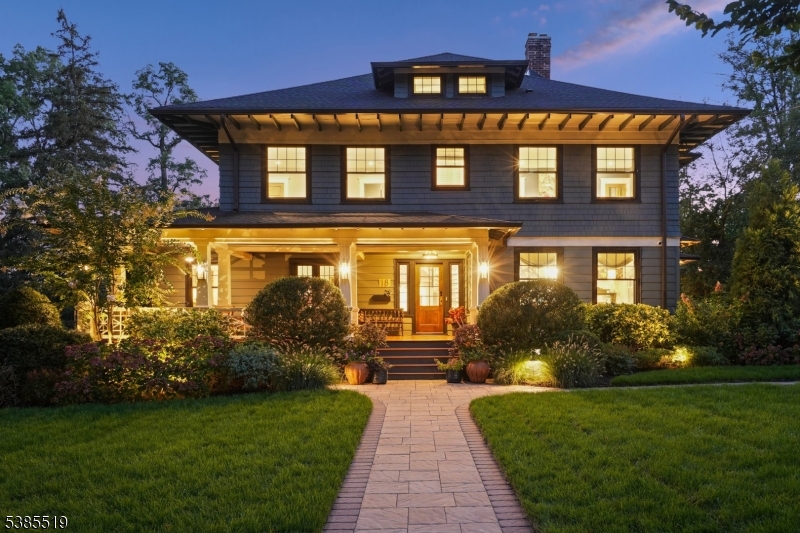 Stunning, sophisticated and renovated to perfection, this breathtaking 6 bedroom, 5 bath colonial showcases exquisite taste, superb design and supreme functionality. Luxurious living areas and meticulously curated outdoor spaces offer a unique blend of timeless elegance and understated luxury. The welcoming front porch leads you to a front foyer with coat closet. A spacious, light-filled living room opens to a wood-paneled library meticulously renovated in 1930. The dining room, with original stained glass windows, wood-burning fireplace and custom moldings provides the perfect setting for intimate gatherings. A showstopping double-height kitchen designed by award-winning Plumberry Designs includes Tedwood custom cabinetry, Thermador, JennAir and Sub-Zero appliances, Brizo faucets, a separate bar area/wine storage, and a generous-sized separate pantry with second dishwasher. The adjoining family room with direct-vent gas fireplace is anchored by custom glass doors leading to outdoor patios. A powder room completes this level. The second level offers four bedrooms, three full baths and convenient laundry while the primary bedroom includes three custom closets, a luxurious full bath with double vanities and oversized steam shower. Walk up to two additional bedrooms and full bath. The finished lower level includes a game room, second laundry and gym. Located on one of Maplewood's most sought-after tree-lined streets with vibrant downtown and train access to NYC just steps away.