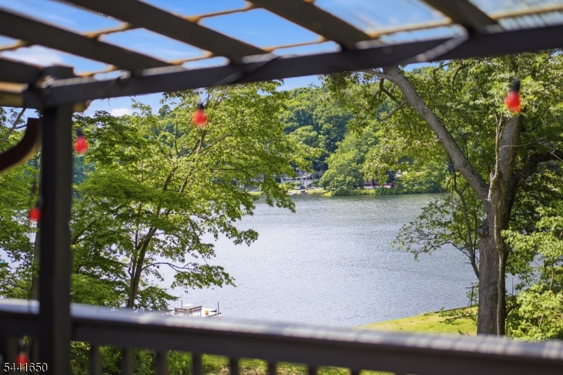 Experience the best of Highland Lakes living in this move-in-ready home with beautiful lake views and easy access to the beach. Nestled in the sought-after Highland Lakes community, featuring seven beaches across five lakes, you'll enjoy boating, kayaking, sailing, fishing, hiking, skiing, and year-round recreation just moments from your doorstep. Offering 3 bedrooms and 3 full bathrooms, this inviting home combines comfort, charm, and functionality. Step onto the deck and take in peaceful lake views while enjoying your morning coffee or evening sunsets. Inside, you'll find new appliances and spacious living areas designed for everyday living and entertaining. During the colder months, gather around the cozy fireplace and enjoy the warmth and ambiance it brings to the home. Whether you're hosting, relaxing after a day on the water, or taking advantage of the community's many amenities, this home offers the perfect balance of recreation and tranquility. Enjoy all the benefits of lake living without the premium price of lakefront ownership. Don't miss this opportunity to own your own lakeside retreat in Highland Lakes, where every season offers something special.