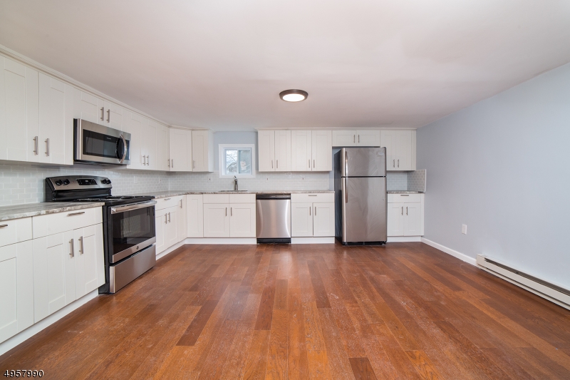 Fully renovated 3 bedroom 1 bath  with 1 car garage raised ranch on large corner lot close to route 23 for an easy commute. Home features brand new roof, siding, windows, electric, plumbing, flooring, cabinets, quartz counter tops, stainless steel appliances and much more. Seller is providing the buyer with a one year home warranty at closing.