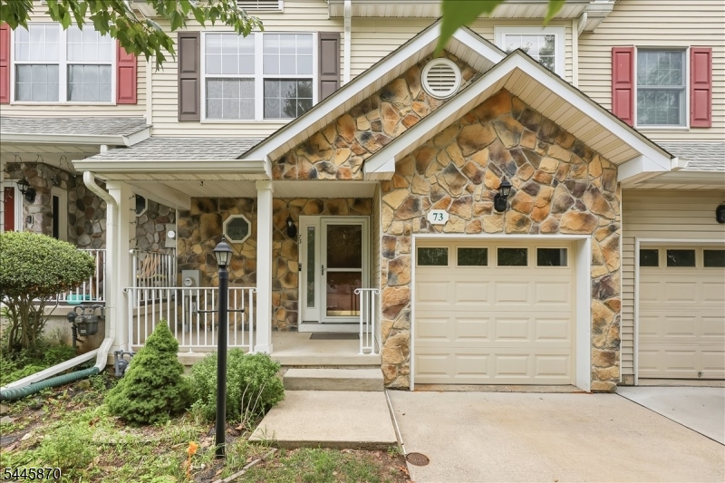 Elegant and impeccably maintained, this east facing 3-bedroom, 2.5-bath townhome in the highly sought-after Princeton Village community offers refined living within the award-winning Montgomery Township School District. Fresh paint, hardwood floors and a fireplace with detailed crown-molded mantel anchor the light-filled living room, which opens to a private deck overlooking mature trees, perfect for entertaining or quiet mornings. The adjoining dining area is finished with a modern chandelier for an open, elevated feel throughout the main level. The eat-in kitchen features granite countertops, a designer tile backsplash and warm wood cabinetry. Upstairs, the oversized primary suite impresses with a spacious layout, a generous walk-in closet with custom shelving, and a private en-suite bath featuring a soaking tub and separate glass-enclosed shower. Enjoy a convenient 2nd floor laundry and two additional bedrooms offer flexibility for guests, or a home office. The finished basement adds valuable bonus space, while the attached garage comes equipped with an installed EV charger, ready for your electric vehicle. Located in desirable Princeton Village, this home offers easy access to downtown Princeton's shops and dining, plus convenient commuter routes to NYC and Philadelphia. A rare opportunity in one of the region's premier school districts.