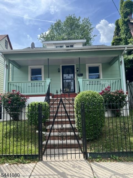 Hardwood floors throughout the first floor bedrooms, dining room, and living room. Two car garage and additional parking in yard for three cars. Eat in kitchen. Nice front porch with room to add furniture to enjoy your mornings or evenings.****More Photos Coming***