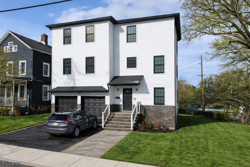 Newer construction legal two-family home situated on a corner lot in Bloomfield offering approximately 3,654 square feet with a flexible multi-level layout. Unit 1 " First and Ground Floor Living Arrangement offers 4 bedrooms and 3 full bathrooms. The ground level extended suite is connected internally to the first floor and provides additional finished living space including an entertainment area, wet bar, dishwasher, separate washer and dryer, engineered hardwood flooring, and access to a private balcony overlooking the rear yard. This space is part of Unit 1 and is not a separate apartment. Unit 2 " Second Floor Residence features 4 bedrooms and 2 full bathrooms with open living and dining areas and a modern kitchen layout. Both residences include stone countertops, 42-inch cabinetry, breakfast bar seating, dishwashers, primary bedroom ensuite bathrooms, and in unit stackable washer and dryer. Conveniently located approximately one half mile from the Bloomfield NJ Transit train station with direct service to Hoboken and connections to New York City. Easy access to the Garden State Parkway, Route 3, and Interstate 280. Close to Bloomfield Center shopping, dining, and local amenities. Move in ready legal two-family home offering a flexible multi-level layout with extended living space.*Taxes have been adjusted the correct annual taxes are $25,047.53*