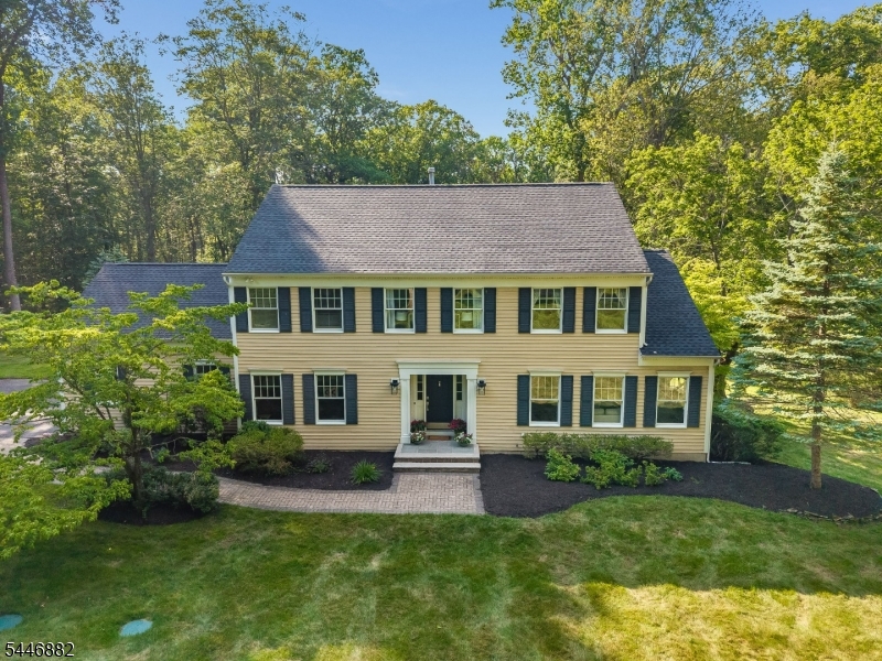 Nestled on a picturesque 6.7-acre property at the end of a quiet cul-de-sac. This charming 4-bedroom, 2.1-bath Center Hall Colonial offers the perfect blend of privacy, space, and timeless appeal. Inside, you'll find beautiful hardwood floors throughout and a sun-filled living room highlighted by a large bay window. The inviting family room features a cozy fireplace, creating the perfect gathering space for relaxing or entertaining. Glass doors open to a spacious deck overlooking the expansive backyard, providing a seamless transition to outdoor living. The partially finished walkout basement offers flexible space for a recreation room, home office, fitness area, or additional storage, while the two-car attached garage adds everyday convenience. Peace of country living, yet minutes from parks, farms, top-rated schools, shopping, dining, and major commuting routes. Whether you're looking for a private retreat or a home designed for comfortable everyday living and entertaining, this is the spot.