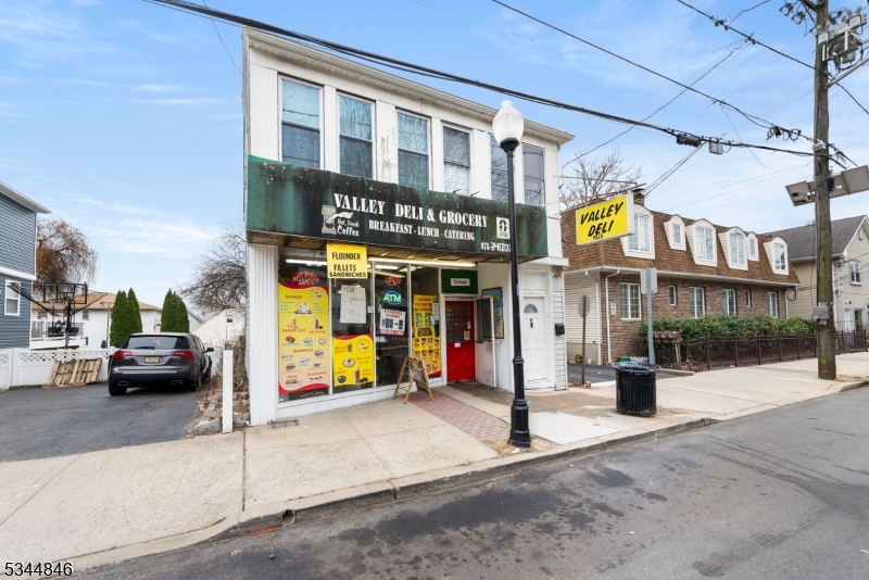 LOCATION, LOCATION, LOCATION! Mixed-Use Building in the Heart of Clifton. This prime mixed-use property, located off a main road in the highly sought-after area of Clifton, offers an incredible investment opportunity. Whether you're looking to open your own business or generate rental income, this property has endless potential. The first floor features a storefront NOW VACANT, providing immediate rental income or the flexibility to set up your own business in a high-traffic area. The spacious, light-filled second-floor apartment boasts hardwood flooring throughout, with a roomy living room and dining room, two sizable bedrooms, a fully equipped kitchen, and a newly renovated bathroom. The 3rd level features an additional 3 bedrooms .This property is ideally located near major highways, schools, and parks, making it convenient for both residents and businesses. Whether you're seeking a place to run your business or a property to invest in with multiple rental streams, this building offers exceptional value in a highly desirable area.