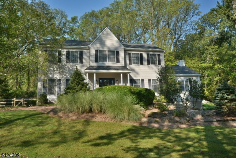 Located in desirable Hunterdon County (just past Clinton) - Discover the perfect blend of privacy, space, and comfort in this beautifully updated Colonial, tucked away at the end of a quiet cul-de-sac in sought-after Hickory Ridge. Surrounded by scenic year-round views, this home offers a peaceful setting with exceptional convenience.A welcoming foyer leads to elegant formal living and dining rooms and a stunning renovated eat-in kitchen designed for both everyday living and entertaining. Features include custom cabinetry, a built-in refrigerator/freezer, and newer high-end SS appliances. Sliding doors open to a spacious deck, while the breakfast area flows into the large family room with a FP. The main level also includes a private den, a PDR, and a laundry area. Upstairs, the MBR suite offers a walk-in closet and an updated bath, along with three generously sized bedrooms, a refreshed hall bath, and pull-down attic access. The finished lower level offers exceptional versatility, with a recreation room, a wet bar with a new refrigerator, a dedicated gym, a mudroom, a utility/storage room, and direct access to garage. Outside, enjoy a large, level, fenced backyard designed for relaxation and entertaining, featuring an oversized deck with a retractable awning, a storage shed, and an additional seating area. Recent updates include a newer roof and low-maintenance vinyl siding. Top-rated HC schools, close shopping and dining, just off I-78 Exit 12, 2025 property taxes: $14,551.
