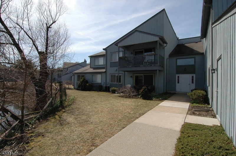 MOVE IN READY! HOME WARRANTY INCLUDED!  AWESOME 3 BEDROOM, 2 FULL BATH CONDO WITH WATER VIEW FROM MASTER BEDROOM.  UPDATED FLOORING IN LIVING AND DINING ROOM. EAT-IN KITCHEN, TWO BALCONIES--ONE OFF LIVING ROOM AND OTHER OFF MASTER BR.  UPDATED VANITIES IN BATHROOMS.  START OFF YOUR MORNING WITH A COFFEE ON MASTER BEDROOM BALCONY, WITH BEAUTIFUL VIEWS.  DURING THE SUMMER, ENJOY POOL AND TENNIS COURTS.  HOME WARRANTY INCLUDED!  MINUTES TO SHOPPING, RESTAURANTS, PARKS, TRAIN STATION AND MAJOR ROUTES 10, 46, 80 AND 206.  A MUST SEE!