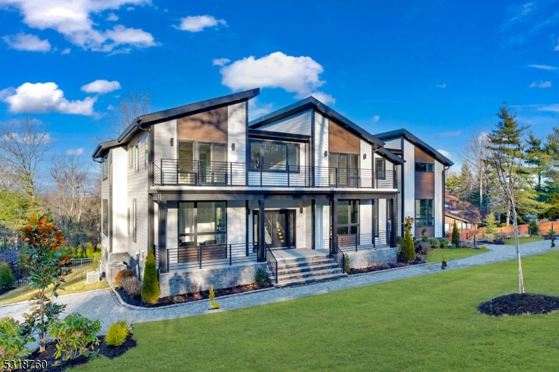 Discover unparalleled luxury in Livingston's upscale Chestnut Hill neighborhood. This breathtaking 7 Beds, 6.5 Bath contemporary Colonial offers 8,000+ square foot spanning three meticulously designed levels on appx 1 acre Resort-Like grounds.This home has it all - POOL, WALK-OUT BASEMENT, state-of-the-art Theatre room, home Office, Gym, Floating Stairs, Multiple Balconies, Designer Primary Closets with an Island, and a Family room that is a masterpiece of design, boasting 20-foot High Ceiling, Massive Windows and a dramatic Double-Sided Fireplace.Other stunning features include Wide Plank hardwood floors, Custom Built-Ins, Designer Trims, and a massive Deck with spectacular Sunset Views, overlooking the sparkling pool and beautifully landscaped, fenced backyard.The home's impeccable finishes create an atmosphere of refined sophistication. The stunning gourmet kitchen features top-of-the-line Sub-Zero and Wolf appliances, designer cabinetry, a massive island with a waterfall countertop, spacious walk-in pantry & a butler's pantry with Wine storage.The luxurious primary suite is a private sanctuary featuring a private balcony, spa-like bathroom, and a massive walk-in closet. The finished basement features 9-foot ceilings, walk in coat closet, and recreation room complete with a wet bar. Additional features include a 3-car garage, cutting-edge smart home technology with Nest & Ring systems, EV charger outlets & 10-year builder warranty. A truly exceptional home!
