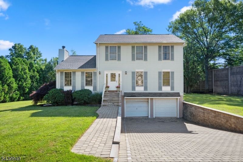 Fully renovated contemporary style colonial; 2-zone heating and cooling system; 4-bedroom (all with ceiling fans), 2.1 bath; eat-in kitchen with stainless steel appliances, granite countertops, large center island, and sliding glass doors leading to the deck; hardwood floors throughout. The main level offers a family room with fireplace, formal living and dining rooms, powder room (LED mirror), and a laundry room with convenient exterior access. A half-basement with ample natural light and with access to the two-car garage; leveled backyard; paved driveway and walkway with interlocking blocks.