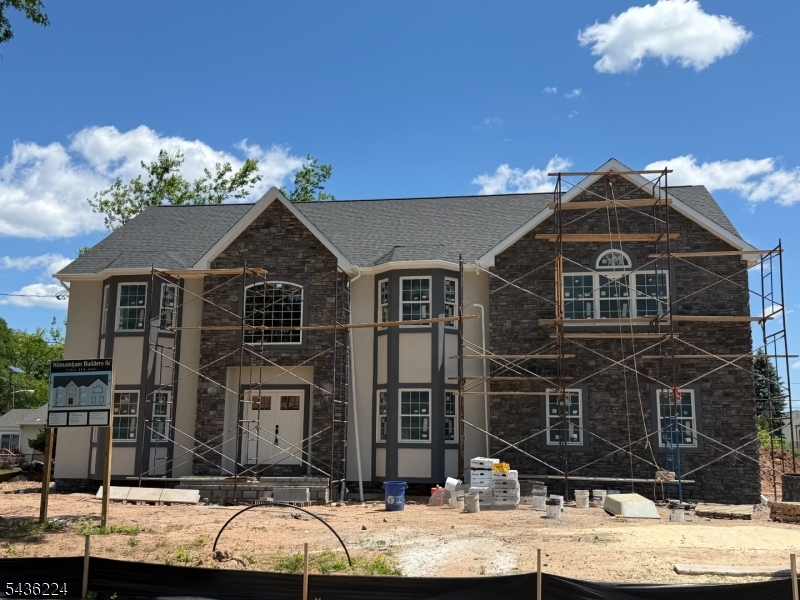This is a fantastic new single family home built by one of Piscataway's premier builders (84 Dwellings in town to date). The lot is conveniently located at the end of Grandview Avenue on an oversized (125' x 100') level lot.  The front is stone and stucco with premium vinyl on three sides including thermal Anderson windows and 30 year dimensional roof shingles. Two car side entry garage. The foundation 9' Superior Wall prepped for a finished basement. The square footage is 4008. Open concept floor plan vaulted foyer, open family room, dinette and kitchen as well as dining room and living room. The kitchen is appointed with designer cabinetry, waterfall island, granite, farm style sink and premium Thermador appliances dishwasher, refrigerator, range top, double wall oven and microwave drawer in island. Bonus room on the first floor next to the full bath that could be an extra bedroom or home office. Flooring is 3-1/4" wide select oak with porcelain in baths and laundry. The master suite is tremendous with bath and closet that are larger than most bedrooms, vaulted ceiling with coffered trim package. Recessed lighting and CAT6 access points are amply supplied. The master bath has a large double vanity, a free standing soaking tub and oversized master shower. All shower/bath areas include custom glass shower doors. The princess suite enjoys a double window, double closet and its own full bath. The remaining two bedrooms have bay windows, double closets and share a main bath.